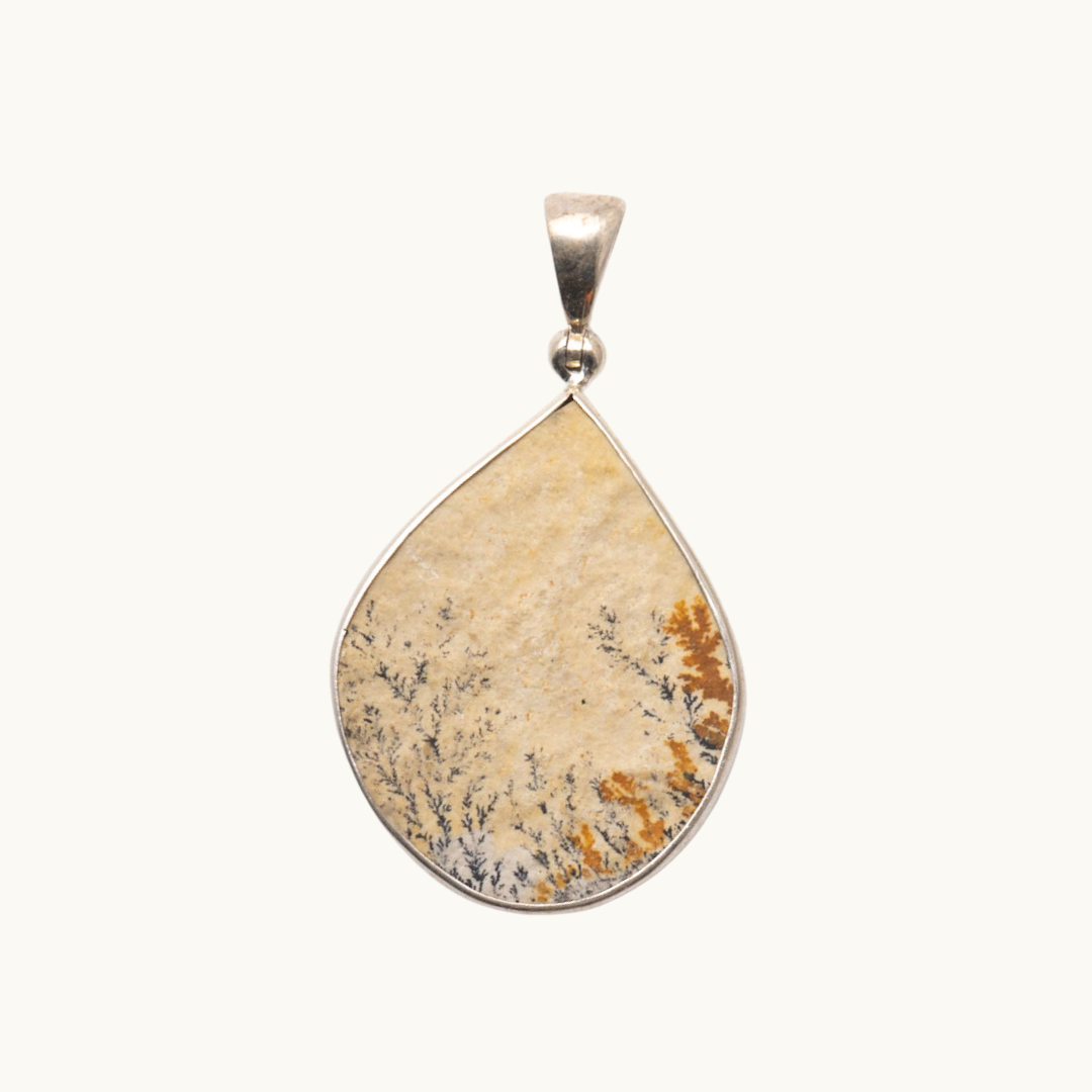 Dendrite Pendant - Connect with the Earth's energy and find stability with our Dendrite pendant. Stone roughly measures 75" +. Each pendant is uniquely chosen for you.