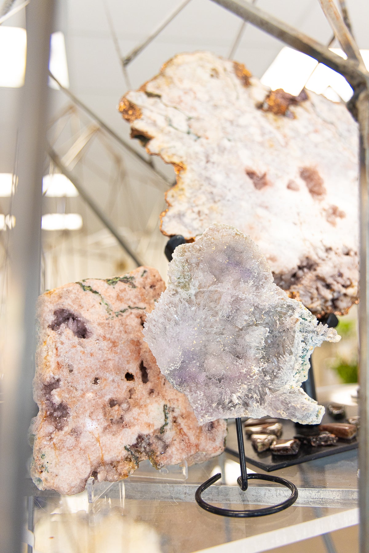 Pale crystals arranged on a display at Juniper Stones
