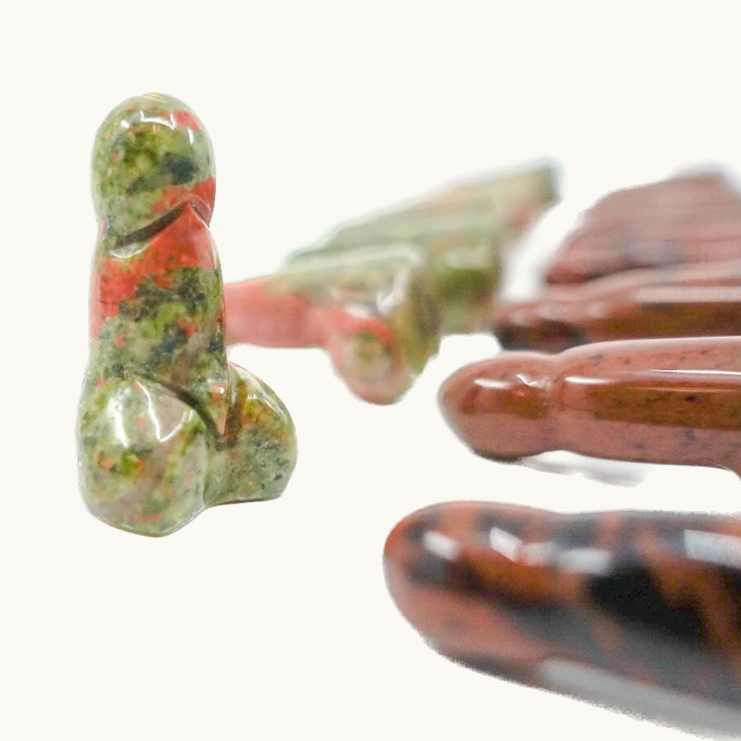  Crystal-shaped phalluses carved from Dalmatian Jasper, Unakite, Clear Quartz, Blue Quartz, Howlite, Moss Agate, and Green Aventurine