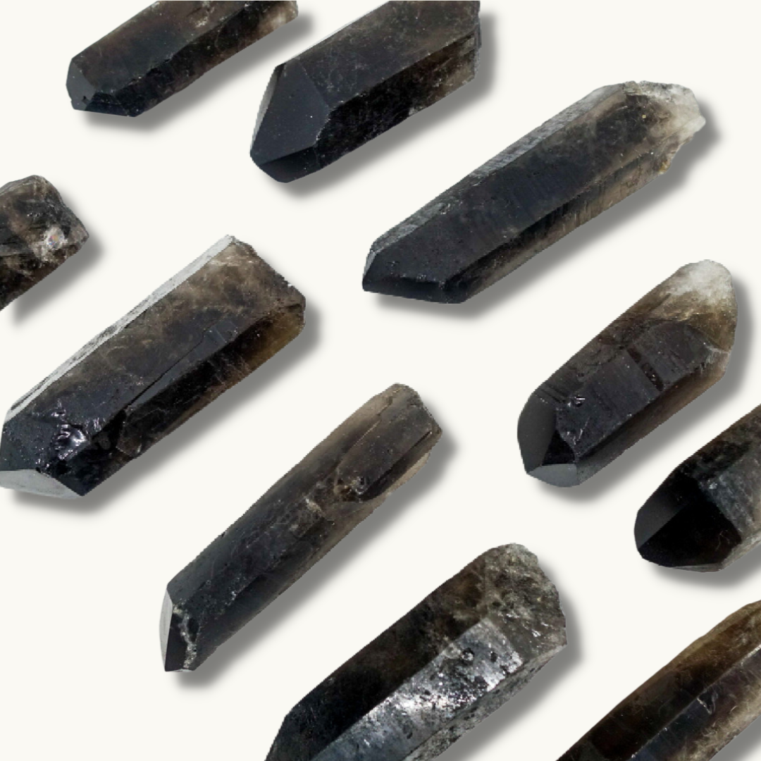 Smoky Quartz points, approximately 2.5"-4.5" in size, known for their grounding and aura purification properties.