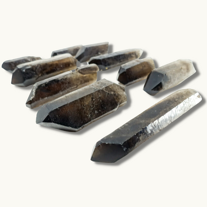 Smoky Quartz points, approximately 2.5"-4.5" in size, known for their grounding and aura purification properties.