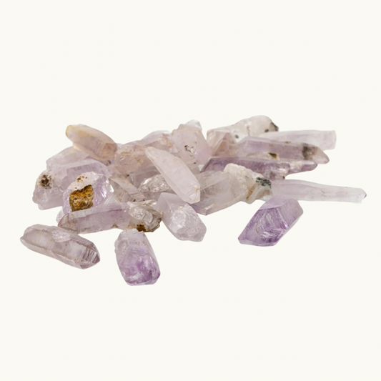 Vera Cruz amethyst crystal, available in small (1.5" x .25"), medium (1.5" + x .50" +), and large enhydro (1.5" x .50" + with trapped water) sizes. Ideal for higher chakra connection, intuition enhancement, and meditation. Shapes and sizes may vary.